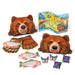 Melissa and Doug Grizzly Bear Game Set showing all the game pieces: Bear heads, paw, salmon, butterflies, berries and Yellowstone National Park map.