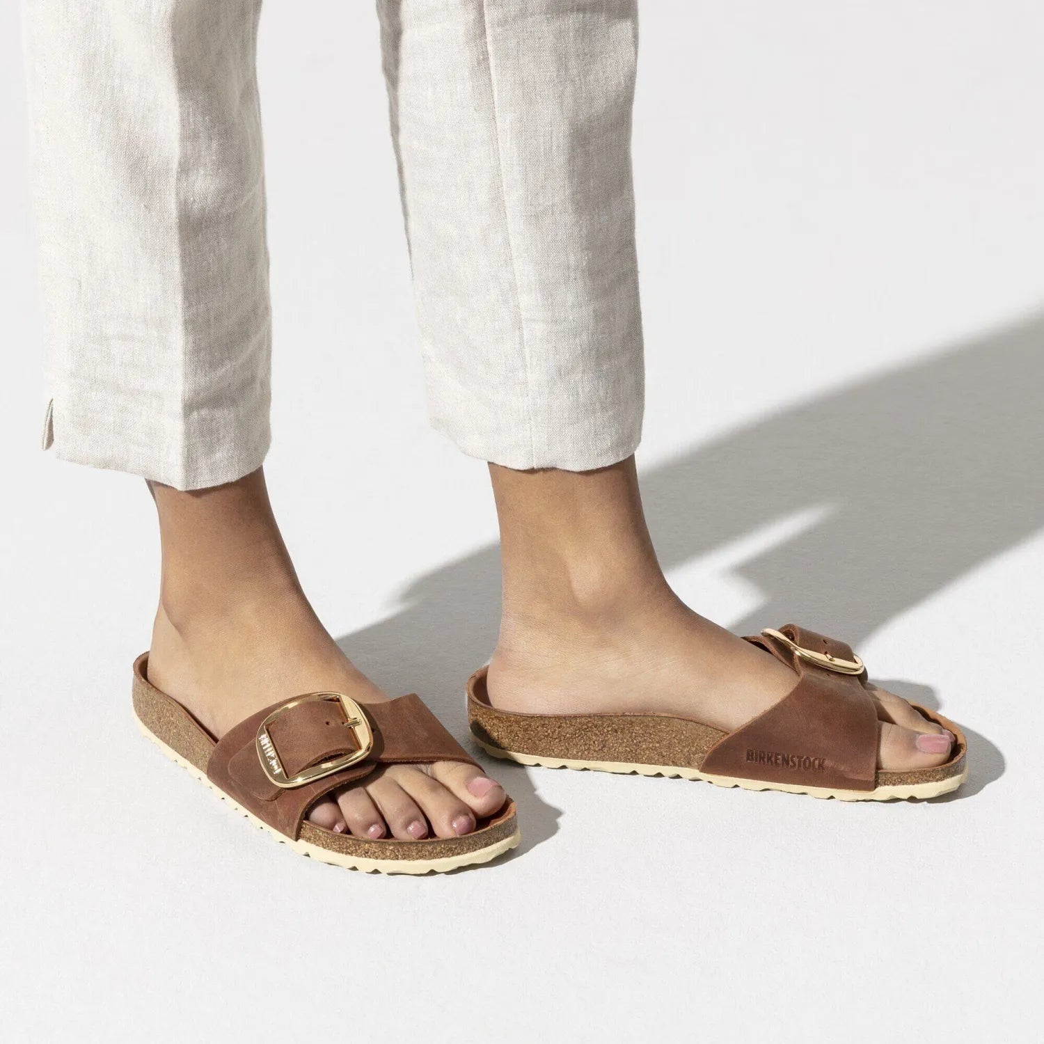 Birkenstock Madrid Big Buckle Sandal in cognac, on model view
