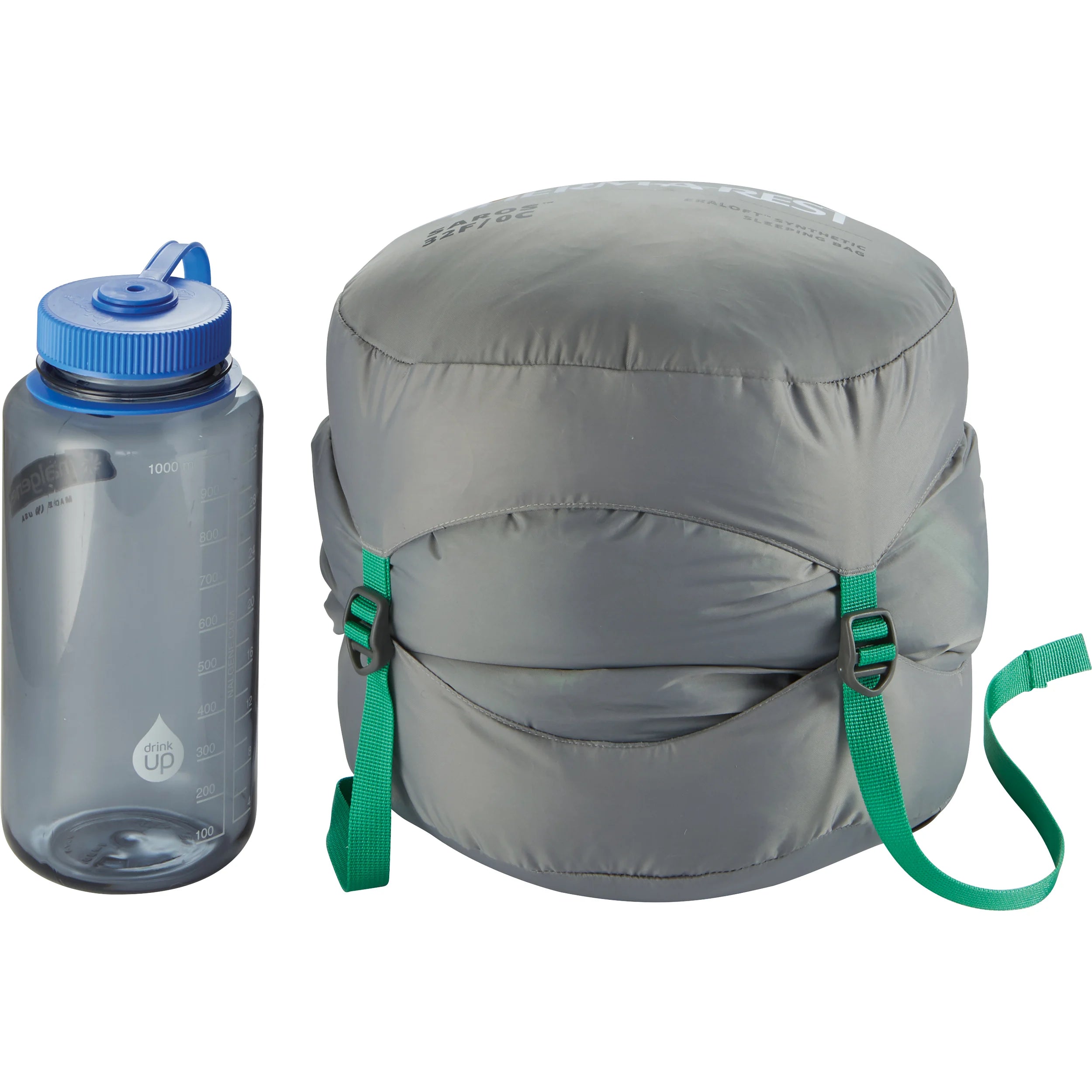 Therm-A-Rest Saros™ 32F/0C Sleeping Bag in regular size in blue with green lining, packed up in compression sak next to nalgene bottle