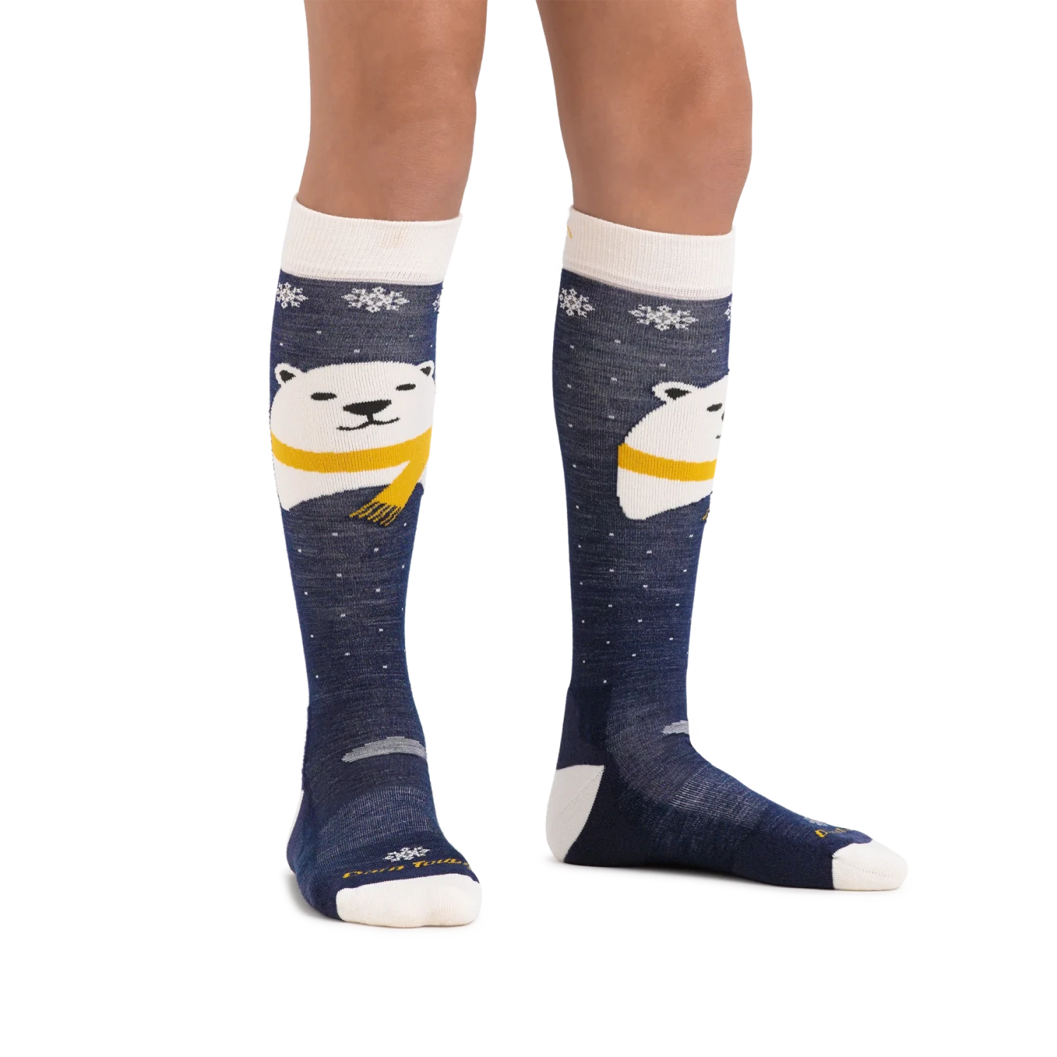 Darn Tough Kid's Polar Bear Over-the-Calf Midweight Ski & Snowboard Socks in blue, on model