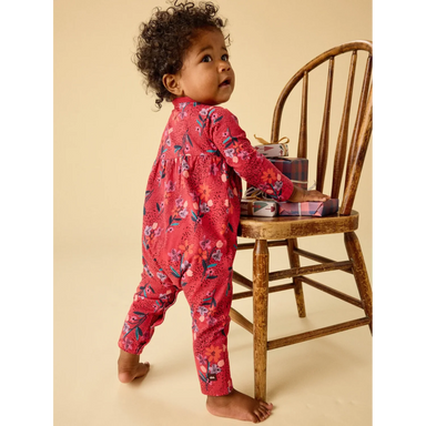 Tea Collection Baby Wrap Neck Romper in vintage french flowers, model back view