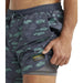 LL Bean Men's All-Adventure Swim Shorts shown in the Carbon Navy Fish Print, on model. Side view.