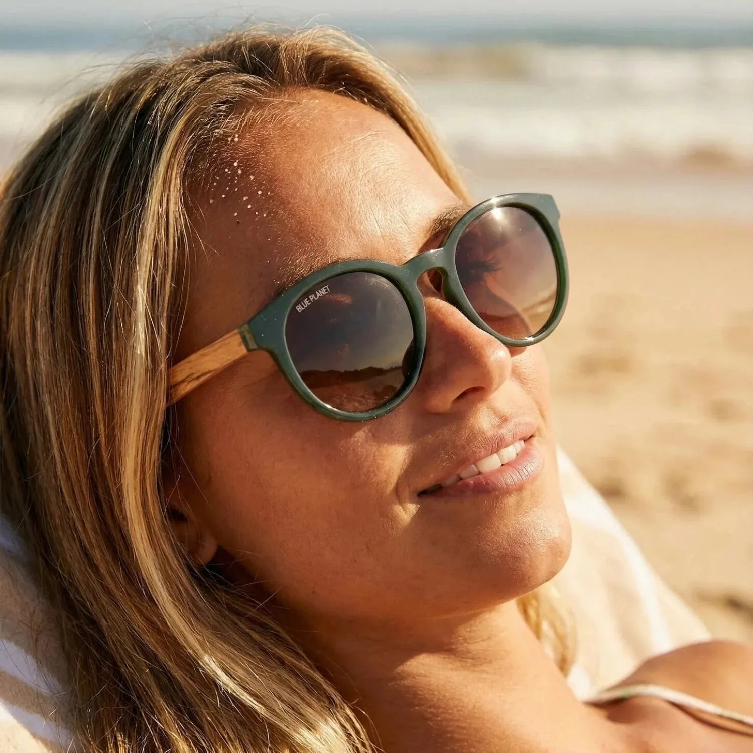 Blue Planet Andiz Polarized Sunglasses in hunter green & zebra wood, on model view