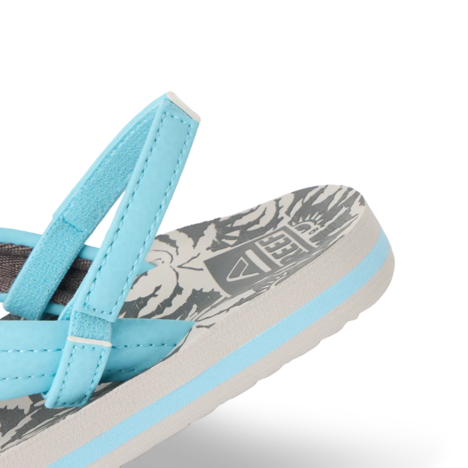 Reef Toddler's Little Ahi Sandal in light blue palm, strap detail view