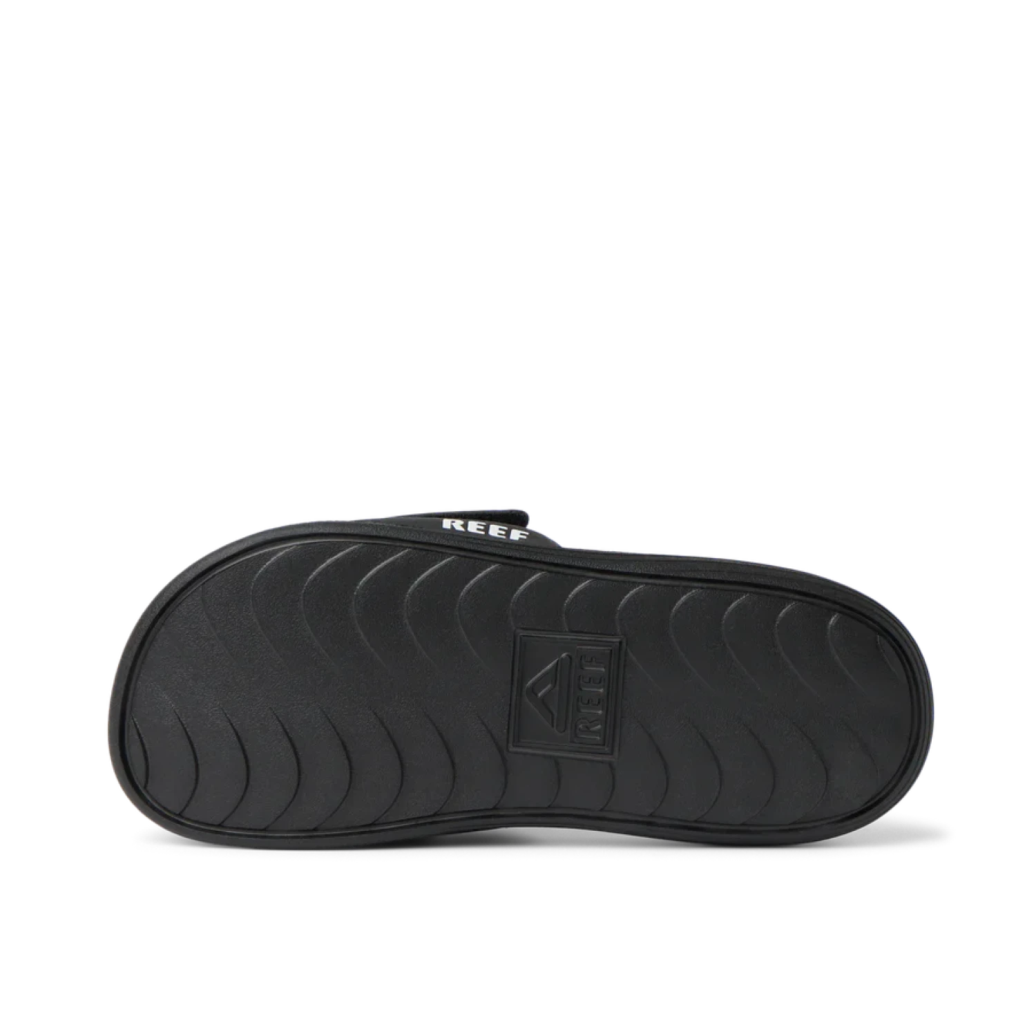Reef Little Salty Slide in black & white, sole view