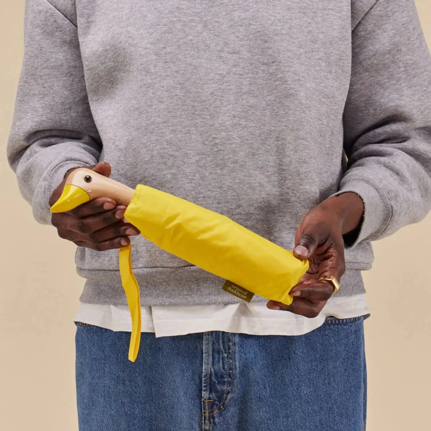Duckhead Original Umbrella in yellow, held by model