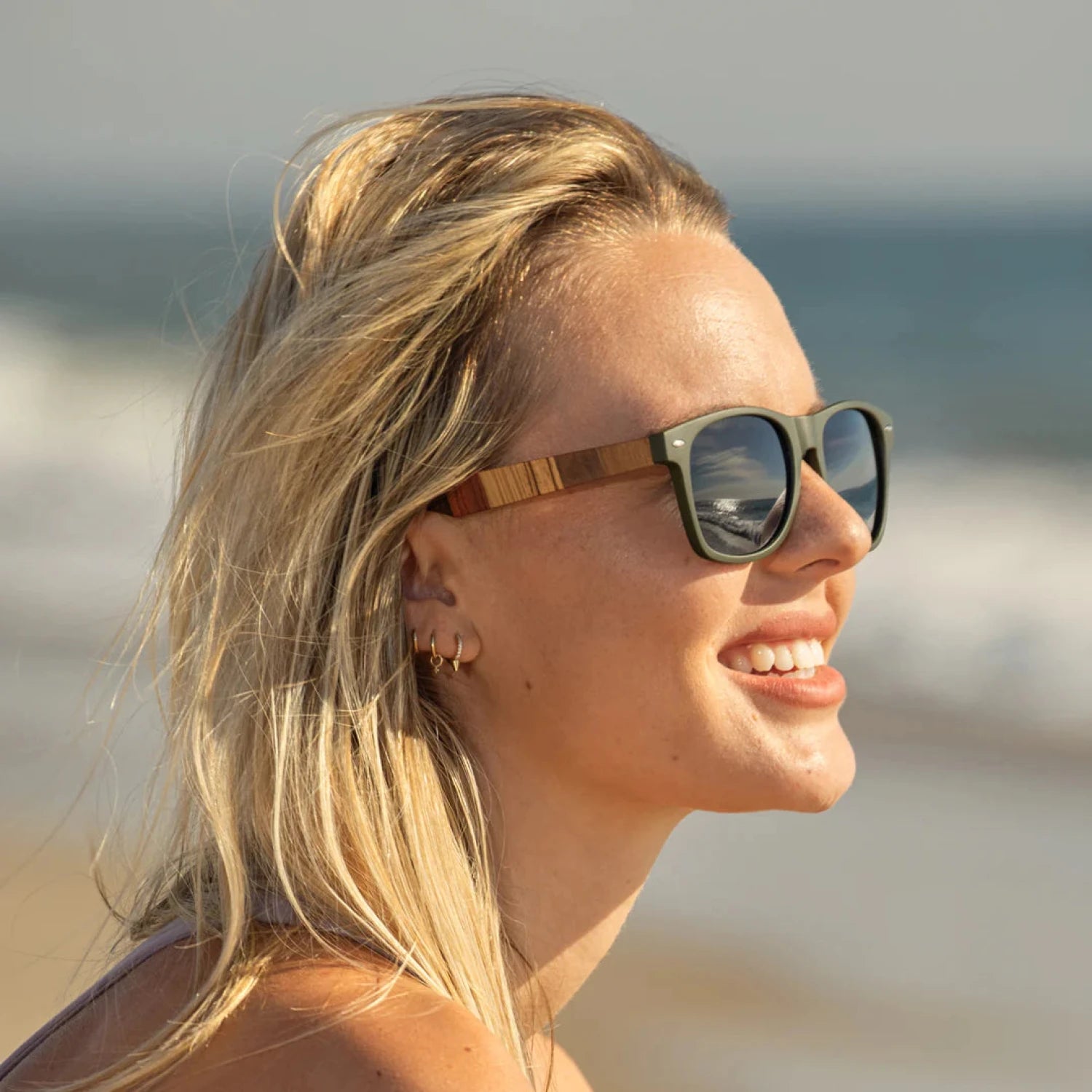 Blue Planet Forest Polarized Sunglasses in olive and multi wood, on model