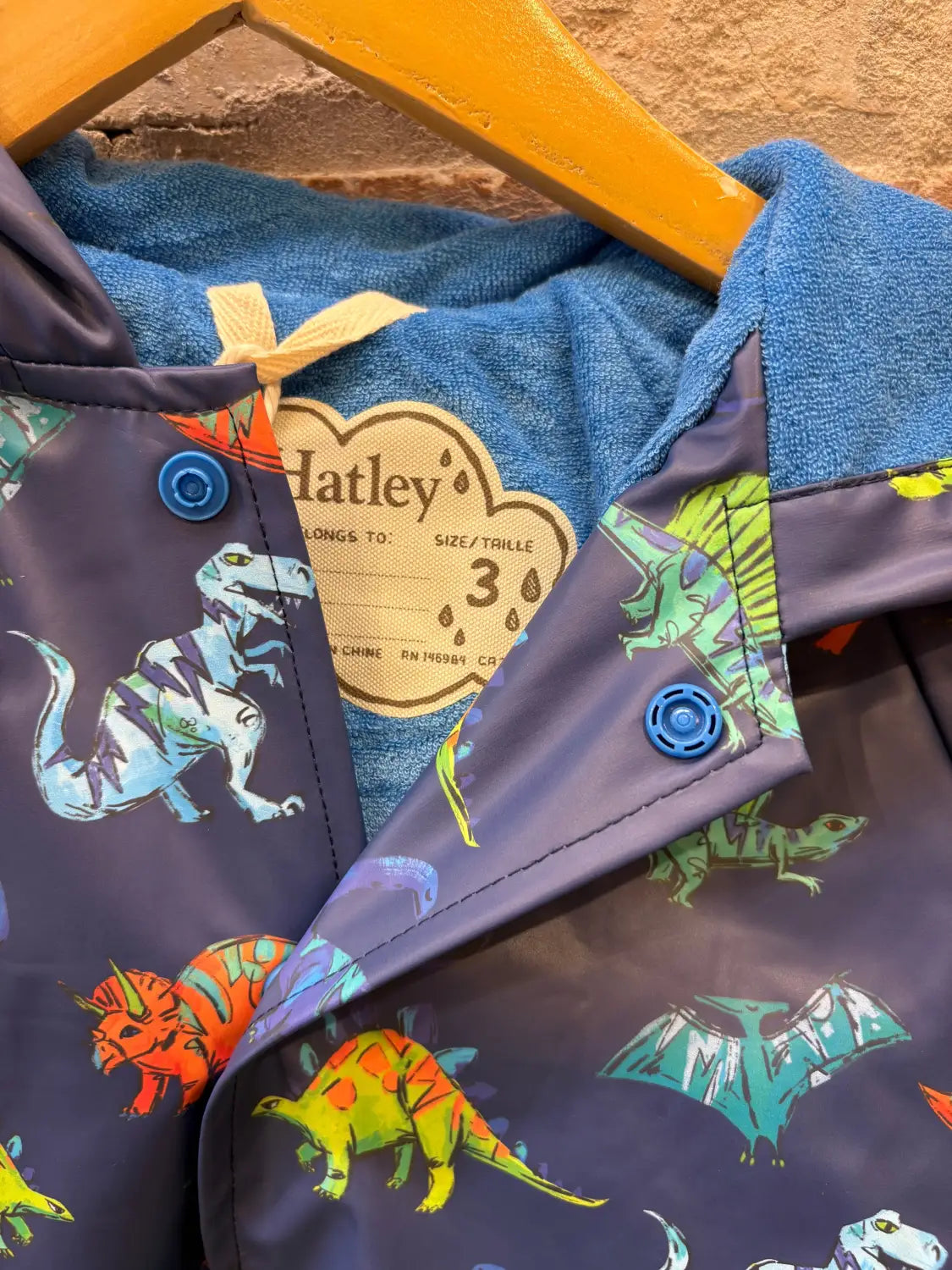 Hatley Kid's Snap Rain Coat, close up blue dinos