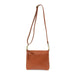 Layla Top Zip Crossbody Bag in Bourbon. Shown with the strap extended to use as a crossbody bag. Front View.
