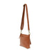 Layla Top Zip Crossbody Bag in Bourbon. Shown with the strap extended to use as a crossbody bag. Side View.
