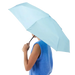 Original Duckhead Ultra Compact Mini Umbrella in popsicle blue, held by model view