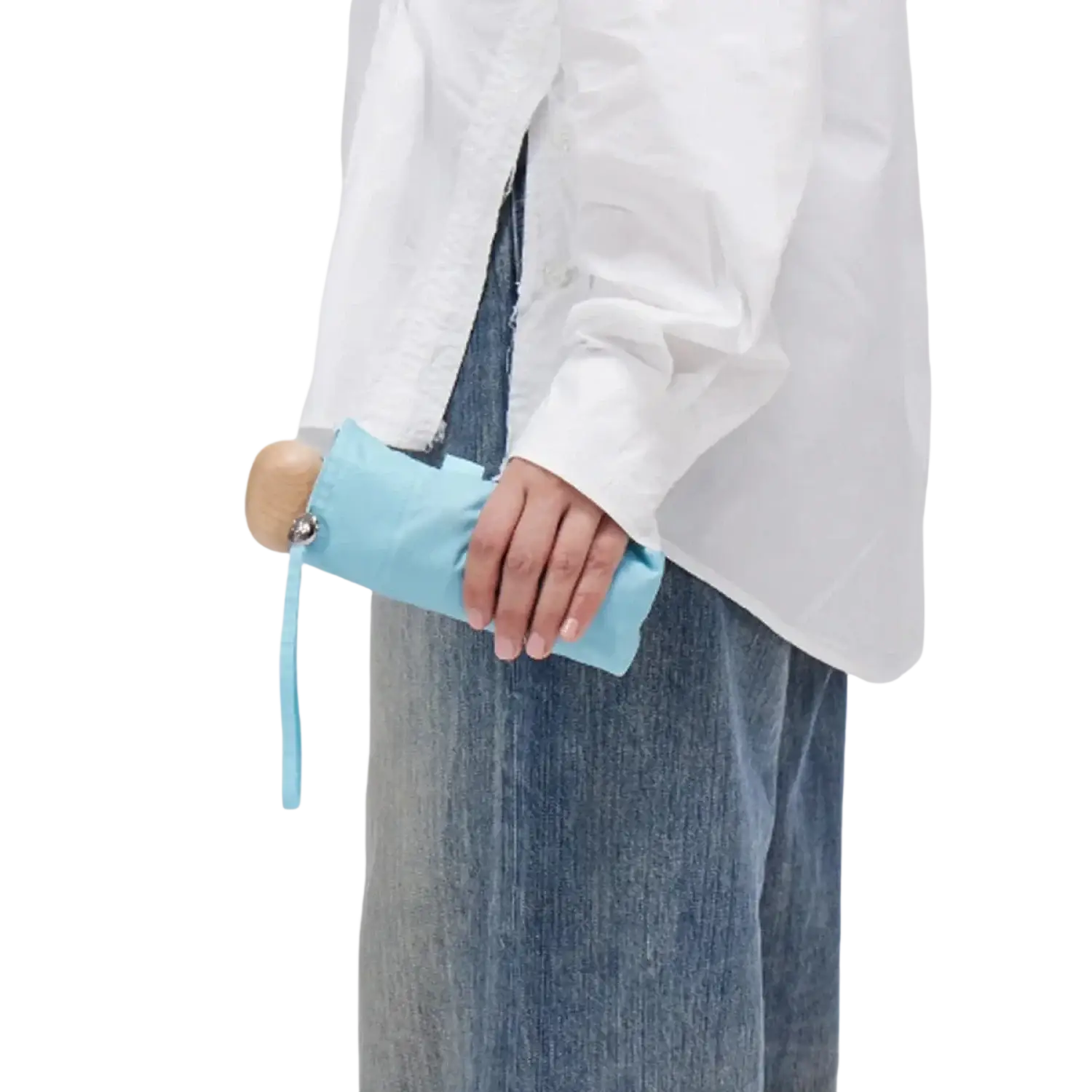 Original Duckhead Ultra Compact Mini Umbrella in popsicle blue, packed held by model view