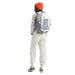 The North Face Women's Recon Backpack in white metallic melange and mid grey, on model