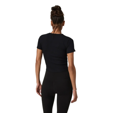 Vuori Women's Pose Fitted Tee in black, on model back view