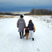 aull dry stormies jacket in petoskey stone gray model walking dog in snow