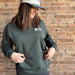 Bearcub Outfitters Unisex Logo Hoodie in Pine Grove, front view on model 