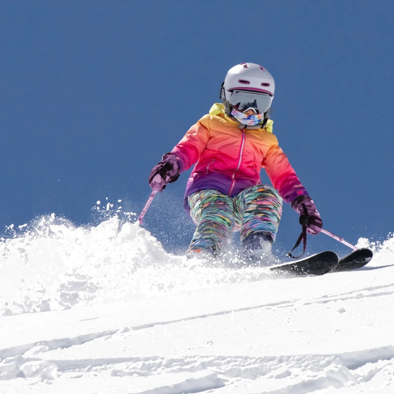 boulder gear girls penny jacket in pink ombre front model skiing view