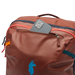 Cotopaxi Allpa 35L Travel Pack in rusty, front pocket detail