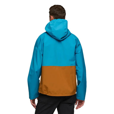 Cotopaxi Men's Cielo Rain Jacket in lake & curry, on model back view
