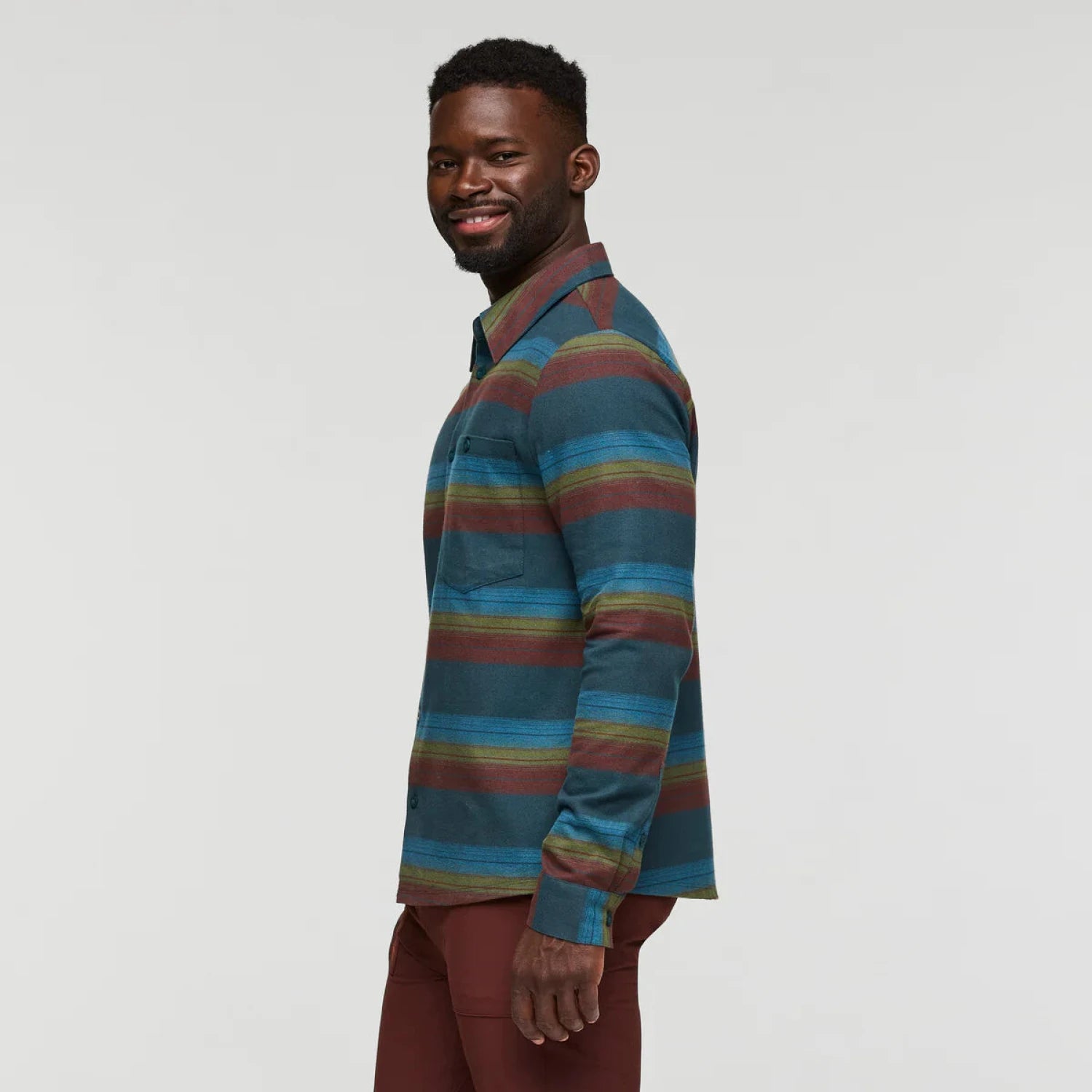 Cotopaxi Men's Quedo Flannel Shirt shown in the Abyss Stripes color option, side view.