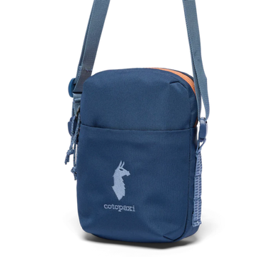 Blue crossbody bag with a visible brand logo on a white background