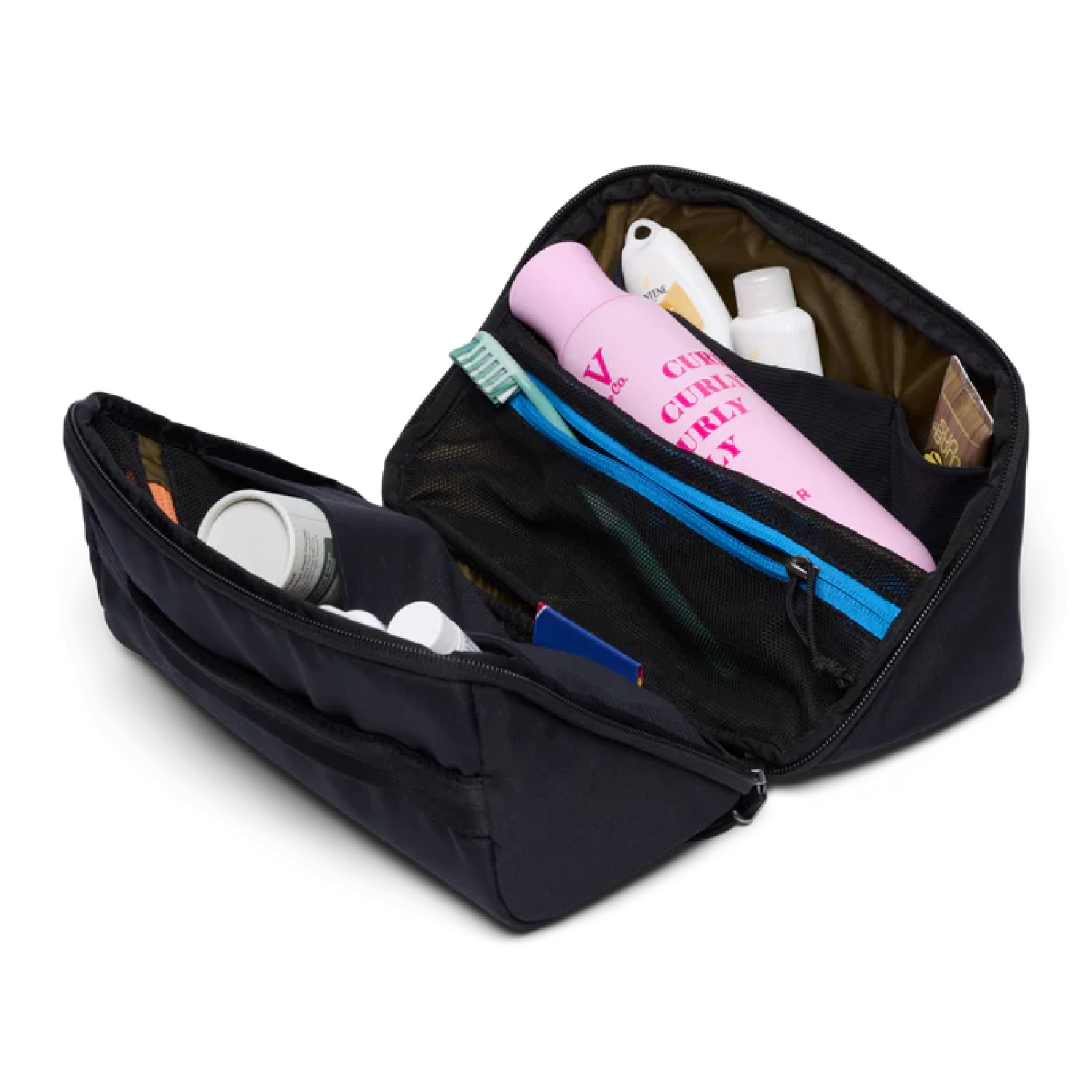 Black toiletry bag with various items on a white background
