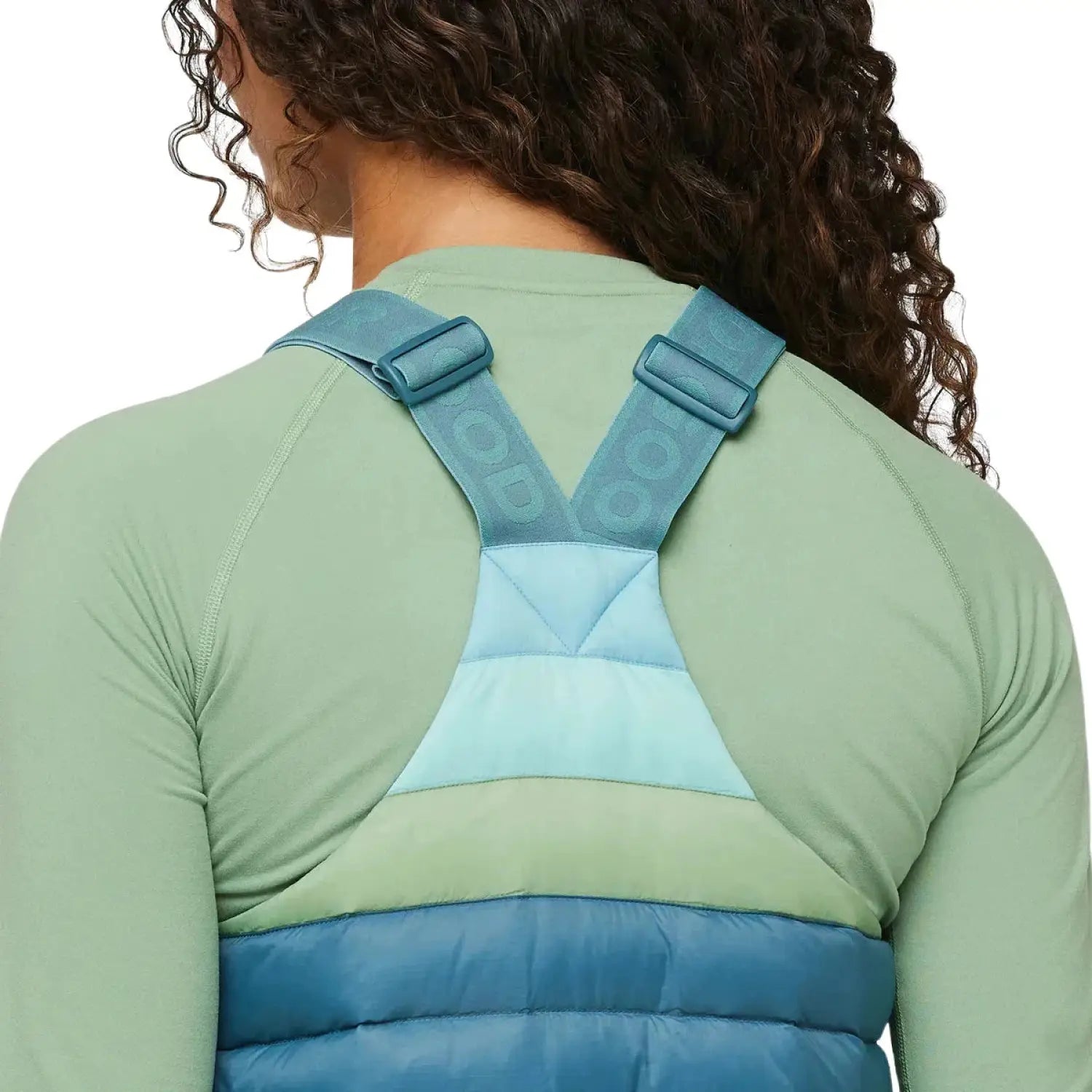 Cotopaxi W's Fuego Down Overall, Blue Spruce Stripe, back view of straps on model