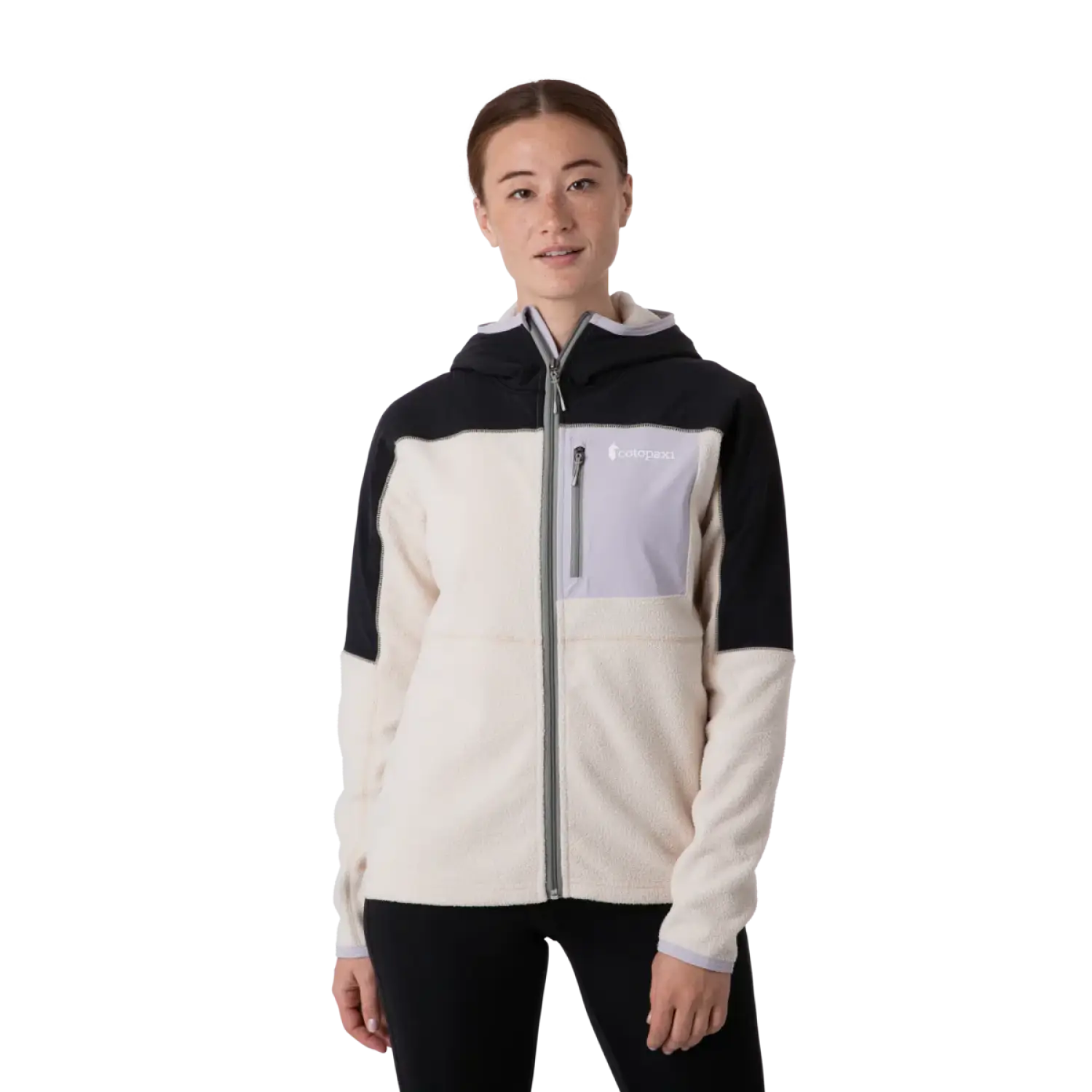 Cotopaxi Women's Abrazo Hooded Full Zip Jacket shown in the Black and Cream color option. Front view, on model.