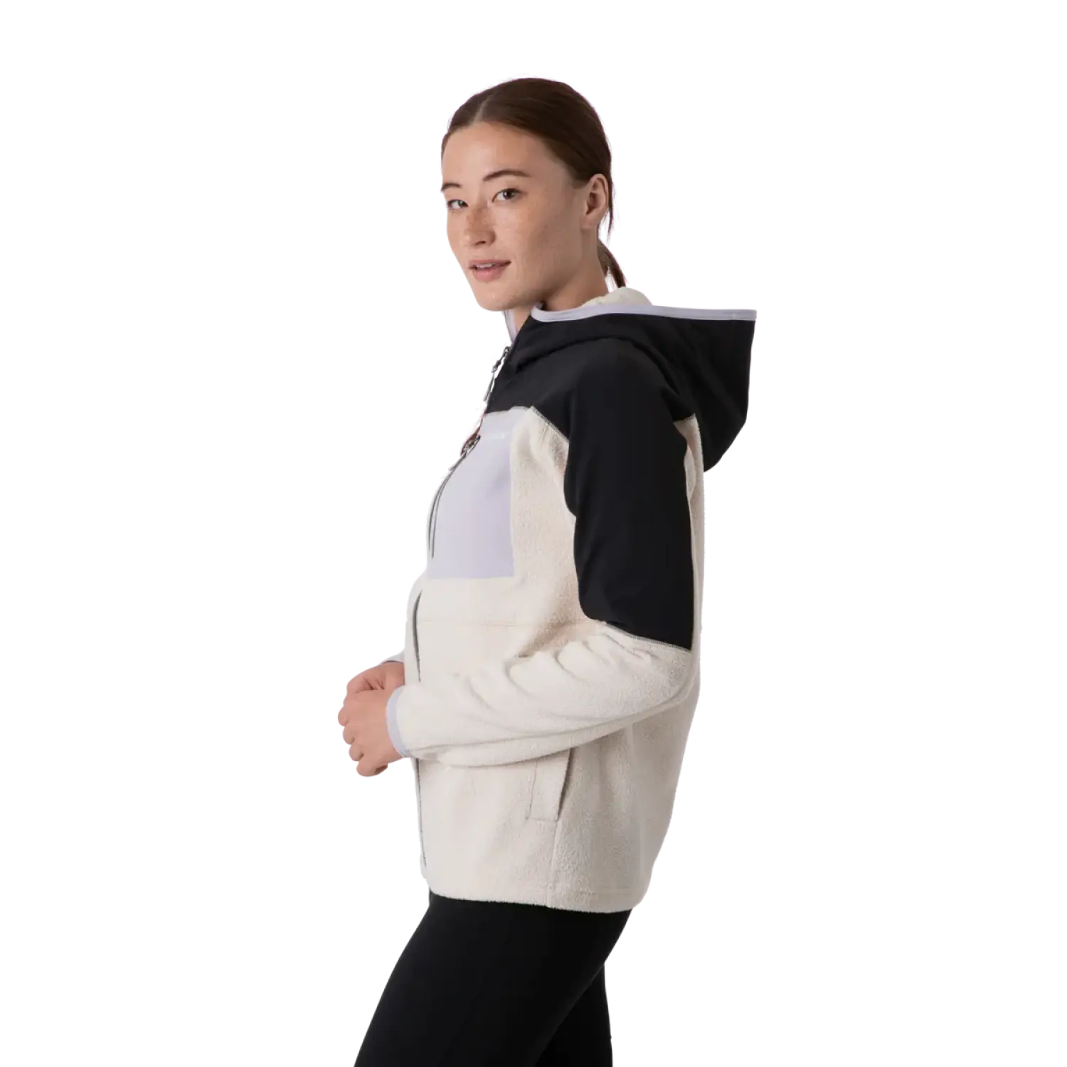 Cotopaxi Women's Abrazo Hooded Full Zip Jacket shown in the Black and Cream color option. Side view, on model.