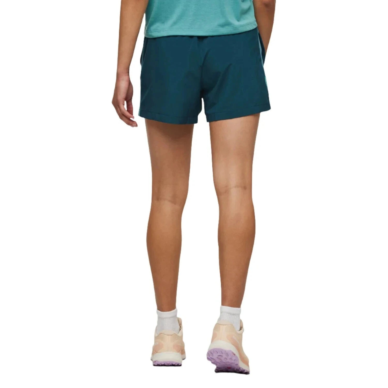 Cotopaxi Women's Cambio Short shown in the Abyss color option. Back view, on model.