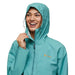 Cotopaxi Women's Cielo Rain Jacket in coastal & graphite on model hood up