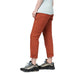 Cotopaxi Women's Salto Ripstop Pant shown in the Spice color option. Side view on model.