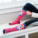 Darn Tough Girl's Magic Mountain Over-The-Calf Midweight Ski & Snowboard Sock Raspberry Top and Side View