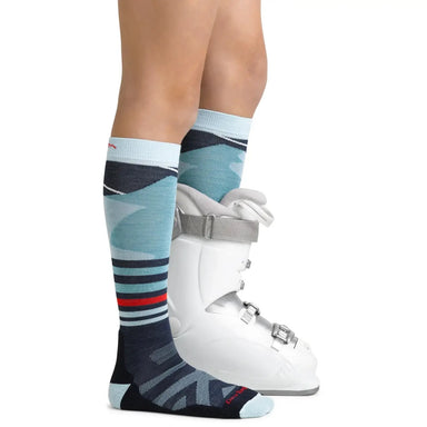 Darn Tough Kids' Skipper Over-the-Calf Midweight Ski & Snowboard Sock Glacier Side View with Snowboard Boot