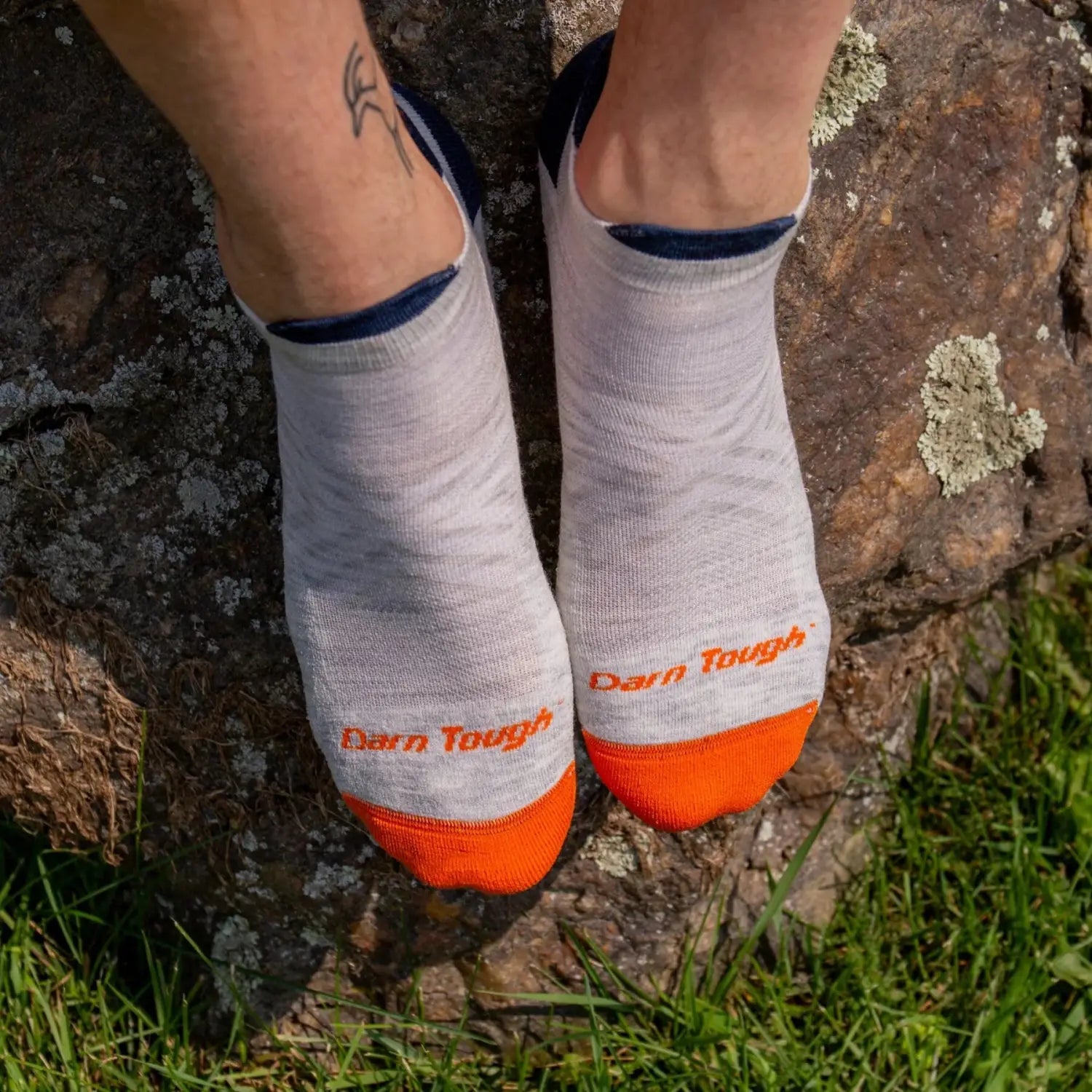 Darn Tough Men's Run No Show Tab Cushioned Ultra-Lightweight Running Socks in Ash, top view on model