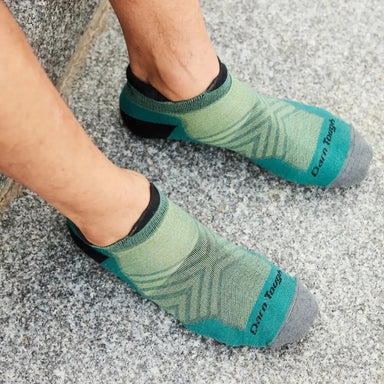 Darn Tough Men's Run No Show Tab Cushioned Ultra-Lightweight Running Socks in Teal, top view on model 