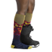 Darn Tough Womens's Enchanted Over-the-Calf Midweight Ski & Snowboard Sock shown in the Autumn design. Shown on model.