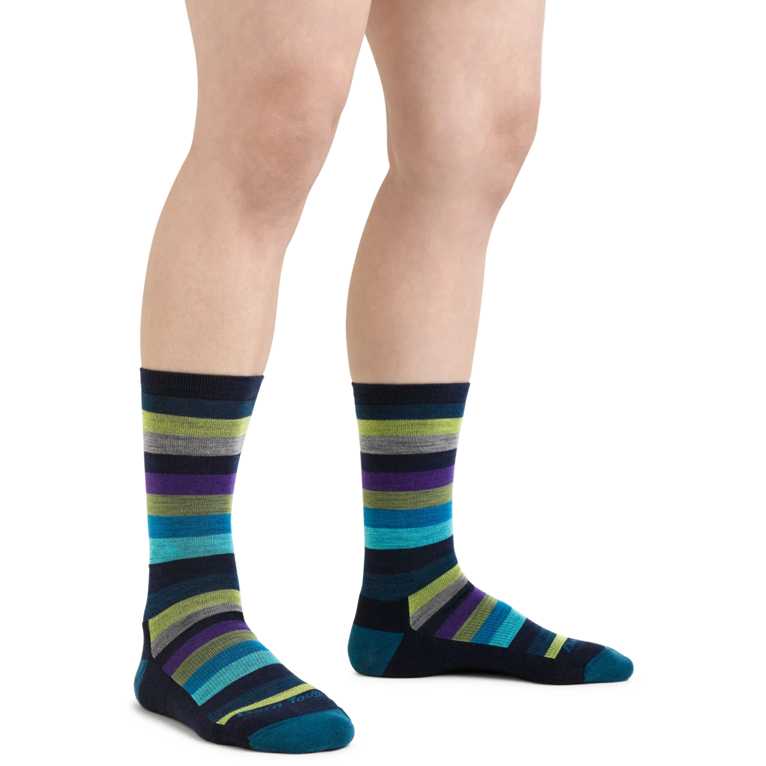 Darn Tough Women's Mystic Stripe Crew Lightweight Lifestyle Sock shown in the Dark Teal color option.  Shown on model.