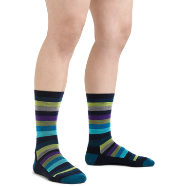 Darn Tough Women's Mystic Stripe Crew Lightweight Lifestyle Sock shown in the Dark Teal color option.  Shown on model.