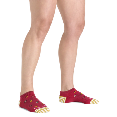 Darn Tough Women's Lucky Lady No Show Lightweight Lifestyle Sock shown in the Cranberry color option. Shown on model.