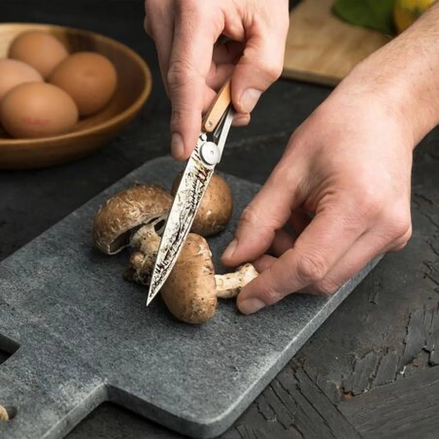 deejo 27g juniper wood mountain knife with mushrooms in background