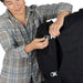 Osprey Fairview™ 55 Travel Pack in black, daypack clipped to big bag
