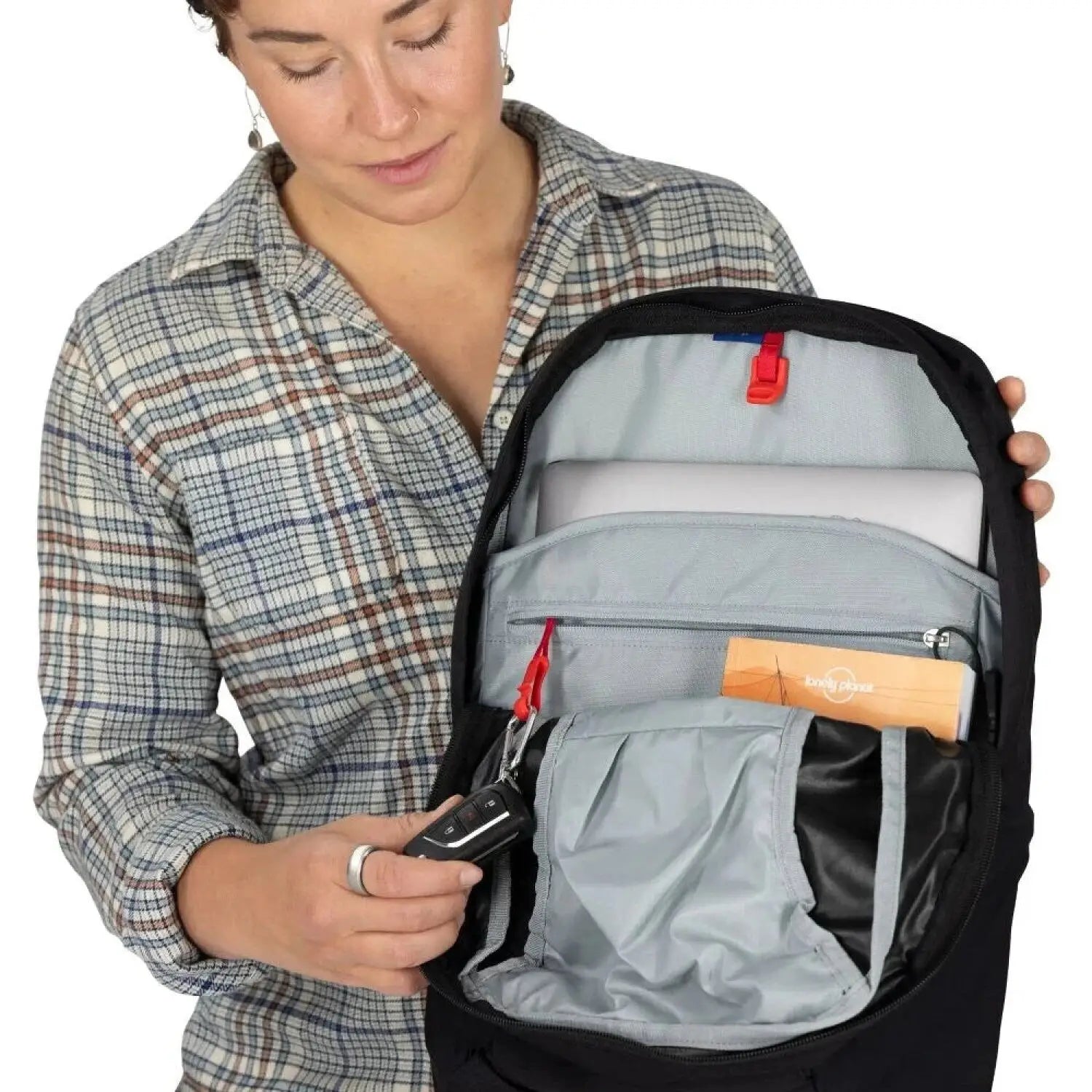 Osprey Fairview™ 55 Travel Pack in black, daypack unzipped