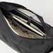 Fjall Raven Färden Crossbody in black, top view main pocket unzipped