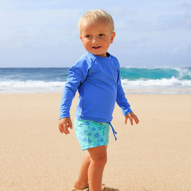 Feather 4 Arrow Baby Surfs Up Rashguard Set in aqua crystal, on model lifestyle view