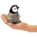 Folkmanis Mini Penguin Baby Emperor, front view on hand model.