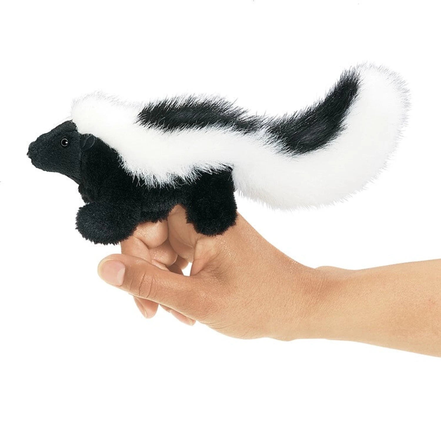 Folkmanis Mini Skunk Puppet, side view on model hand.