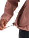 Free fly womens cloudshield rain jacket in light sangria color detailed view of waist cinch with model