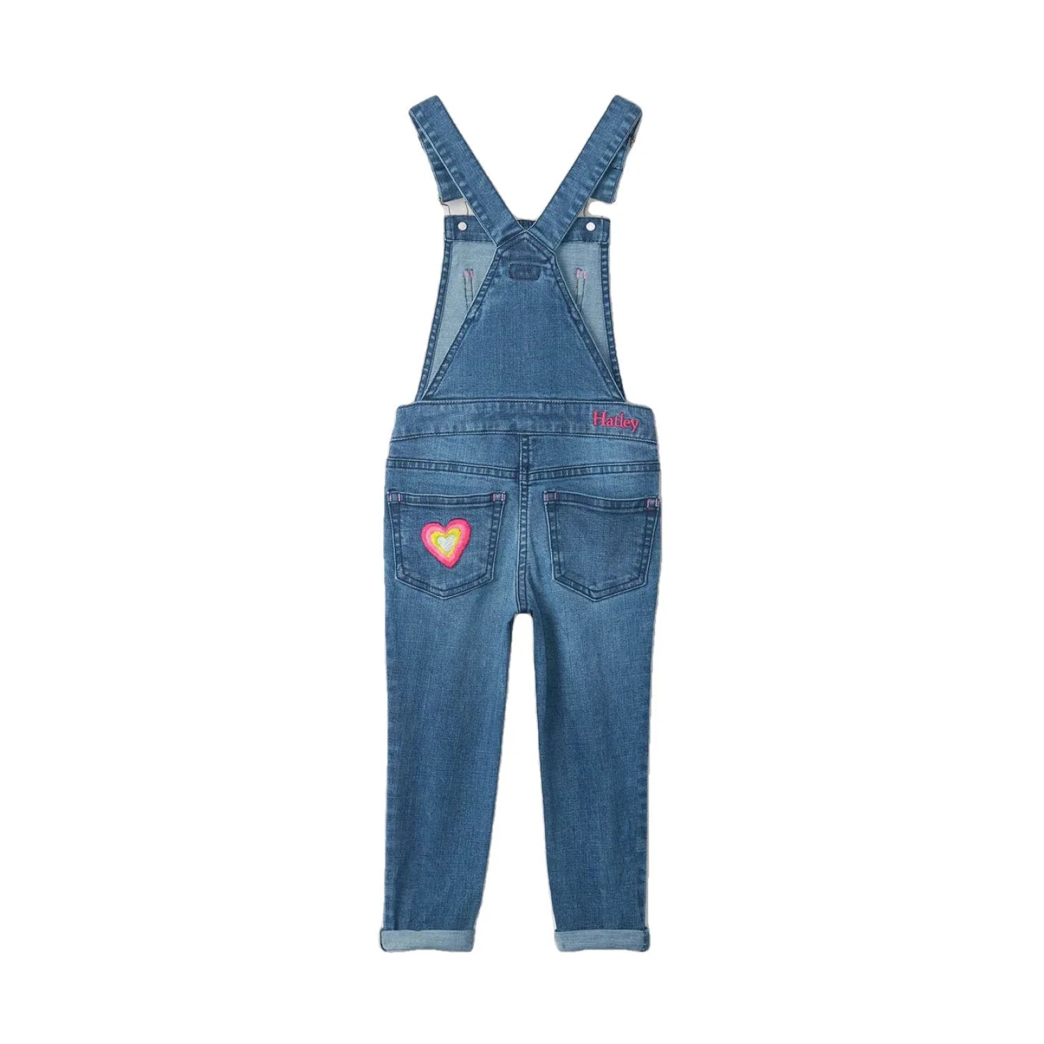 Hatley Girls Denim Stretch Classic Overalls, deep blue, front view. Pink hearts on left back pocket. Pink Hatley logo on right side waist.