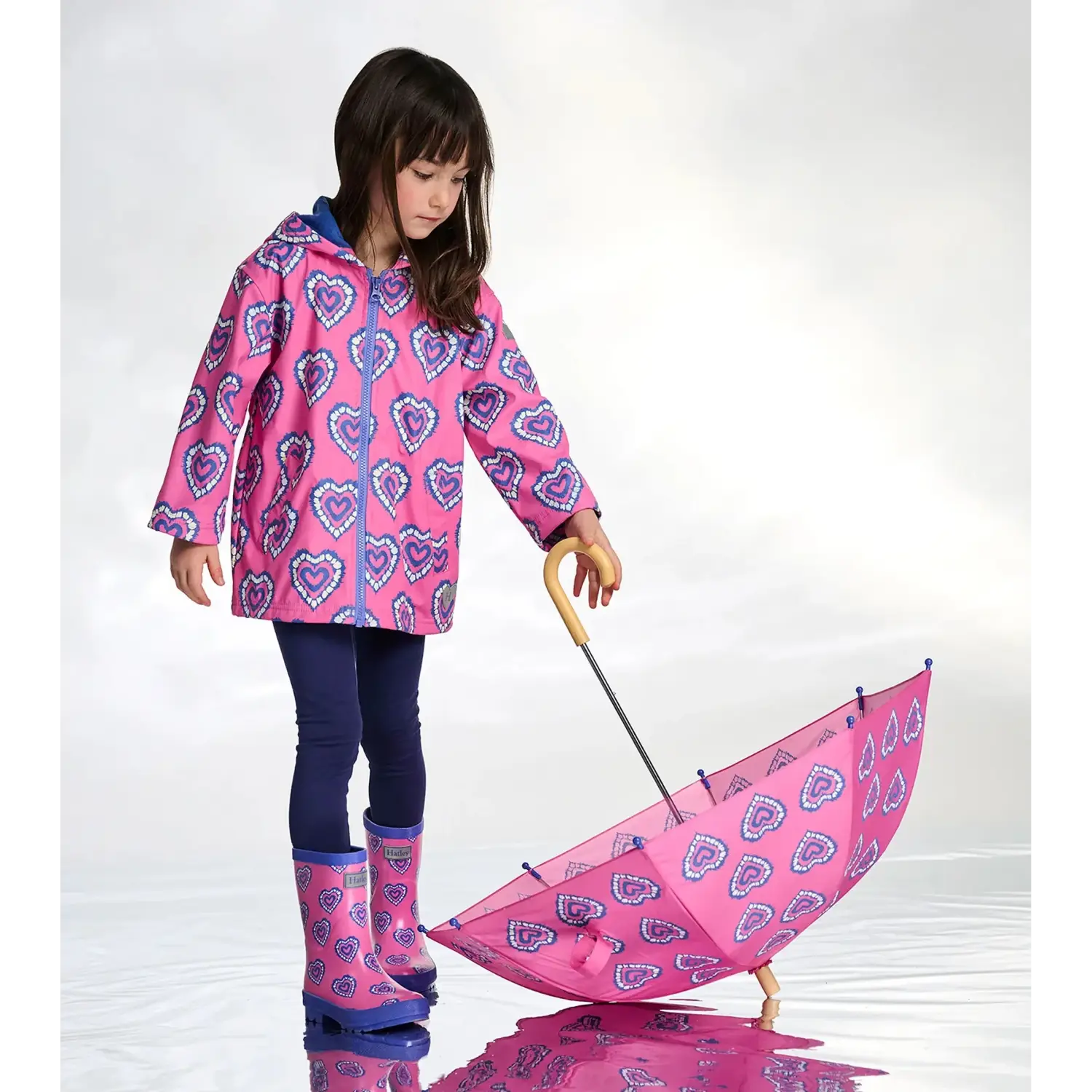 Hatley Kid's Colour Changing Zip-Up Rain Jacket in Heart Burst, front view on model 